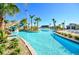 Resort-style pool with water slide, palm trees, and ample lounge space at 730 Drop Shot Dr, Davenport, FL 33896