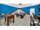 Game room with pool table, foosball, and gaming chairs at 730 Drop Shot Dr, Davenport, FL 33896