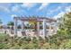 Relaxing pool area with shaded pergola and lounge chairs at 730 Drop Shot Dr, Davenport, FL 33896