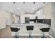 Modern kitchen with breakfast bar and pendant lighting, perfect for entertaining at 730 Drop Shot Dr, Davenport, FL 33896