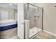 Modern bathroom with walk-in shower and view into bedroom at 730 Drop Shot Dr, Davenport, FL 33896