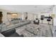 Open living room showcasing a spacious layout, plush seating, and a modern coffee table at 730 Drop Shot Dr, Davenport, FL 33896
