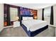 Bedroom featuring a king-size bed and Las Vegas-themed wall art at 730 Drop Shot Dr, Davenport, FL 33896