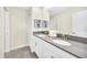 Bathroom with double sinks and gray countertops at 730 Drop Shot Dr, Davenport, FL 33896
