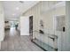 Bright and spacious entryway with contemporary tile flooring and mirror at 730 Drop Shot Dr, Davenport, FL 33896