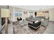 Bright and airy living room featuring comfortable seating and large windows at 730 Drop Shot Dr, Davenport, FL 33896