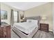 Spacious bedroom with plush bed, nightstands, and ample natural light at 730 Drop Shot Dr, Davenport, FL 33896