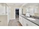 Bathroom boasts double sinks, gray countertops, and a walk-in shower at 730 Drop Shot Dr, Davenport, FL 33896