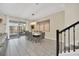 Elegant dining room with a large table, modern chandelier, and access to a backyard patio at 730 Drop Shot Dr, Davenport, FL 33896