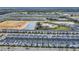 Aerial view of community with various houses and landscape at 730 Drop Shot Dr, Davenport, FL 33896