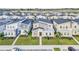 Aerial view of modern homes in a residential community at 730 Drop Shot Dr, Davenport, FL 33896