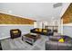Spacious loft with a Minions theme, comfortable seating and access to additional rooms at 730 Drop Shot Dr, Davenport, FL 33896