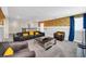 Luminous loft game room with Minions wallpaper, comfortable seating, and a large TV at 730 Drop Shot Dr, Davenport, FL 33896