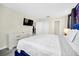 Bedroom with a king-size bed, a dresser, and a view of the upper hallway at 730 Drop Shot Dr, Davenport, FL 33896