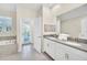 Elegant bathroom with double vanity, soaking tub, and private access to backyard at 730 Drop Shot Dr, Davenport, FL 33896