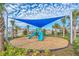 playground with shade structure and playset at 730 Drop Shot Dr, Davenport, FL 33896