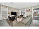 Spacious living room with large sectional sofa, flat-screen TV, and plush rug at 730 Drop Shot Dr, Davenport, FL 33896