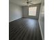 Bright bedroom with ceiling fan and wood-look flooring at 1081 S Hiawassee Rd # 717, Orlando, FL 32835