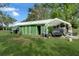 Green workshop with covered parking and large yard at 350 S 5Th St, Orlando, FL 32833