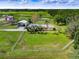 Aerial view of a house on a large property with a fenced yard at 350 S 5Th St, Orlando, FL 32833