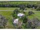 Aerial view of a house and outbuildings on a large property at 350 S 5Th St, Orlando, FL 32833