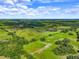 Aerial view of large lot with pastureland and scattered trees at 350 S 5Th St, Orlando, FL 32833
