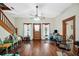 Living room with hardwood floors, a staircase, and a mix of furniture at 350 S 5Th St, Orlando, FL 32833