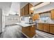 Kitchen with wood cabinets, island, and stainless steel appliances at 350 S 5Th St, Orlando, FL 32833
