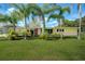 Ranch style home with palm trees and large green yard at 350 S 5Th St, Orlando, FL 32833