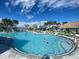 Large community pool with lounge chairs and plenty of space at 4239 Paragraph Dr, Kissimmee, FL 34746