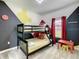 Fun ' bedroom with bunk beds and Mickey Mouse decor at 4239 Paragraph Dr, Kissimmee, FL 34746