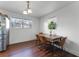 Dining area with wood table, four chairs, and view into living room at 2935 Aein Rd, Orlando, FL 32817