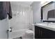 Bathroom with tub, shower, toilet, and dark wood vanity at 2935 Aein Rd, Orlando, FL 32817