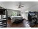 Main bedroom with a ceiling fan, a large bed, and home office setup at 2935 Aein Rd, Orlando, FL 32817
