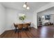 Bright dining area with wood table and four brown leather chairs at 2935 Aein Rd, Orlando, FL 32817