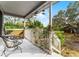 Front porch with wooden bench and views of backyard at 2935 Aein Rd, Orlando, FL 32817