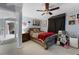 Cozy bedroom with wood bed frame and red blanket at 2935 Aein Rd, Orlando, FL 32817