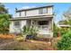 Two-story house with a front porch and garden at 2935 Aein Rd, Orlando, FL 32817