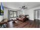 Living room with leather couch and dark hardwood floors at 2935 Aein Rd, Orlando, FL 32817