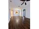 Spacious living room with dark laminate floors and ceiling fan at 2484 San Tecla # 303, Orlando, FL 32835