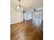 Dining area with dark laminate wood floors and a view into the kitchen at 2484 San Tecla # 303, Orlando, FL 32835