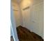 Clean hallway with neutral walls and wood-look floors at 2484 San Tecla # 303, Orlando, FL 32835