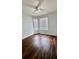 Bright bedroom with wood-look floors and large windows at 2484 San Tecla # 303, Orlando, FL 32835