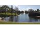 Community pond with fountain and landscaping at 2484 San Tecla # 303, Orlando, FL 32835
