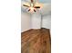 Bedroom with dark laminate wood floors and ceiling fan at 2484 San Tecla # 303, Orlando, FL 32835