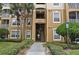 Building exterior with stairs and landscaping at 2484 San Tecla # 303, Orlando, FL 32835