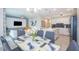 Elegant dining room with glass table and seating for six at 4721 Clock Tower Dr # 207, Kissimmee, FL 34746