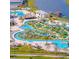 Resort-style pool and amenity area with lazy river and mini golf at 4721 Clock Tower Dr # 207, Kissimmee, FL 34746