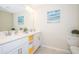 Bright bathroom with double vanity, and a separate shower and toilet at 4721 Clock Tower Dr # 207, Kissimmee, FL 34746