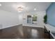 Open living area with new flooring and an accent wall at 1213 Baranova Rd, Ocoee, FL 34761